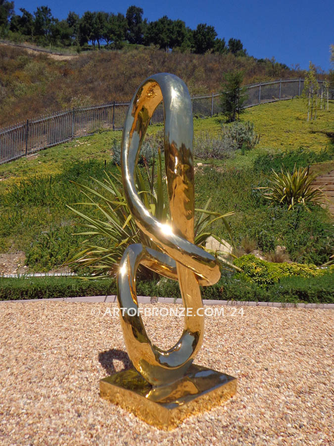 Circe abstract outdoor twisting ribbon polished bronze sculpture