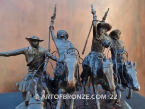 Coming Thru the Rye bronze sculpture after Frederic Remington featuring four horseman on galloping horses