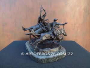 Coming Thru the Rye bronze sculpture after Frederic Remington featuring four horseman on galloping horses