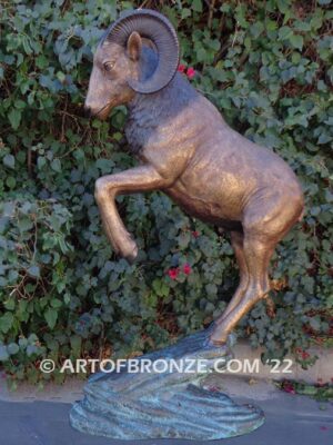 Crashing Titan monumental indoor/outdoor reared up big horn sheep attached to bronze rock ledge