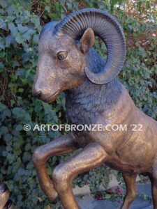 Crashing Titan monumental indoor/outdoor reared up big horn sheep attached to bronze rock ledge