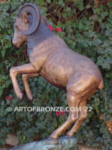 Crashing Titan monumental indoor/outdoor reared up big horn sheep attached to bronze rock ledge