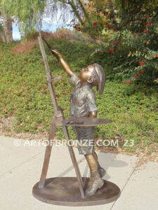 Creative Spirit painter boy bronze statue featuring boy painting canvas