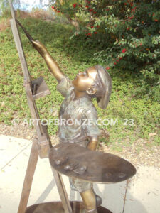 Creative Spirit painter boy bronze statue featuring boy painting canvas