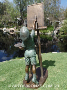 Creative Spirit painter boy bronze statue featuring boy painting canvas