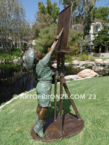 Creative Spirit painter boy bronze statue featuring boy painting canvas