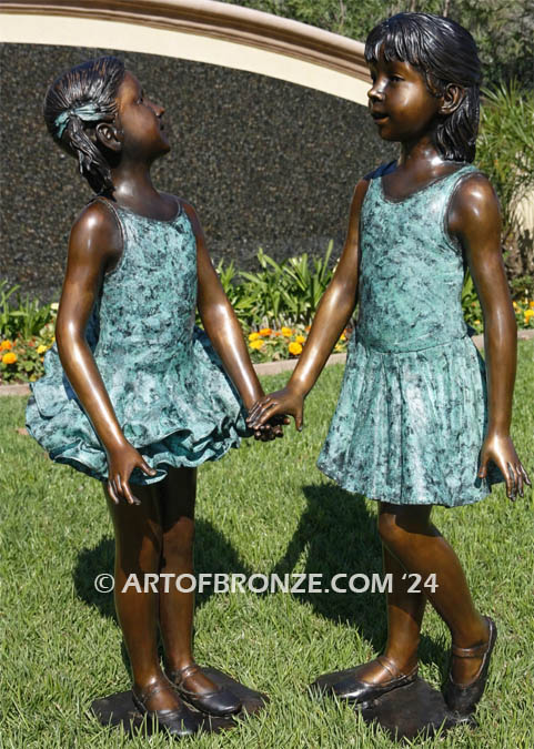 Dance Partners bronze sculpture of two ballerinas holding hands