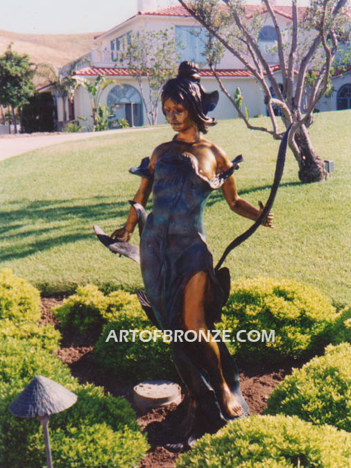 Diane monumental outdoor bronze statue of beautiful woman standing with flowers
