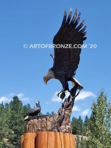 Dinner for Two statue of a life-size bald eagle feeding its baby eaglet in nest