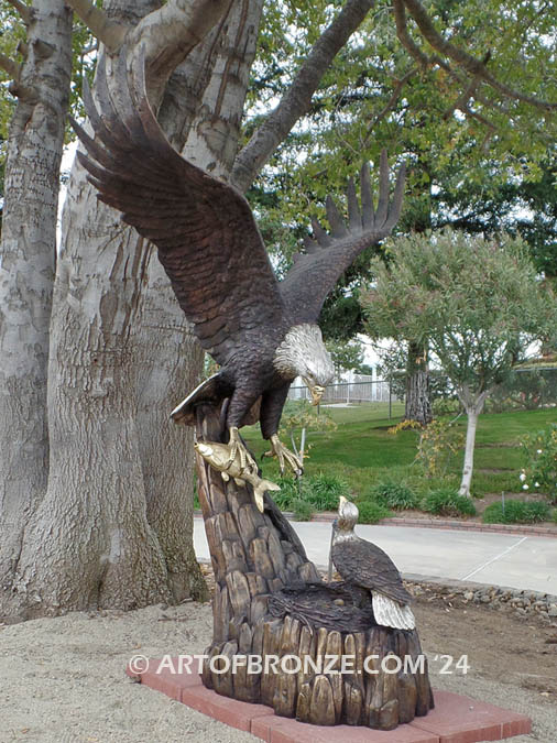 Dinner for Two bronze sculpture of life-size bald eagle feeding its baby eaglet in nest