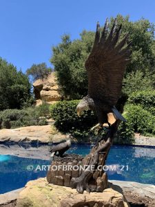 Dinner for Two statue of a life-size bald eagle feeding its baby eaglet in nest