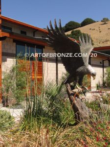 Dinner for Two statue of a life-size bald eagle feeding its baby eaglet in nest