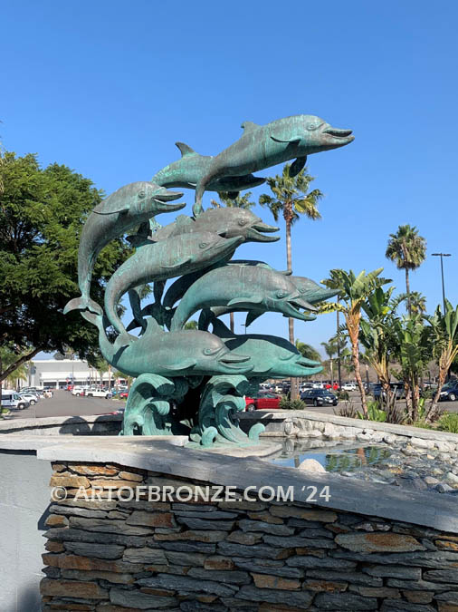 Dolphin Jubilation bronze Art in Public places monument of 12 twelve leaping dolphins over 10 ft. tall