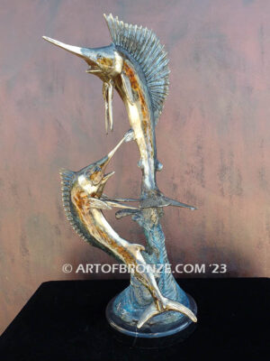 Double Whammy marlin and sailfish leaping through the air bronze statue