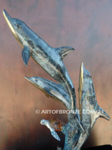 Dream Reef dolphins swimming with seat turtle bronze statue