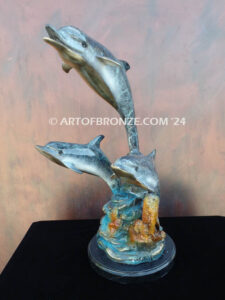 Dream Reef dolphins swimming with seat turtle bronze statue