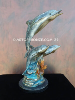 Dream Reef dolphins swimming with seat turtle bronze statue
