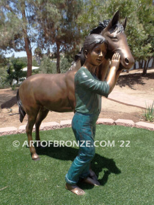 Dreams Come True bronze sculpture of girl petting her pony horse