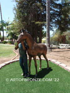 Dreams Come True bronze sculpture of girl petting her pony horse