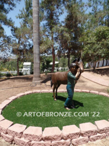 Dreams Come True bronze sculpture of girl petting her pony horse