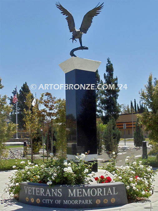 Eagle Veteran Memorial outdoor monumental sculpture of an eagle landing atop granite pillar