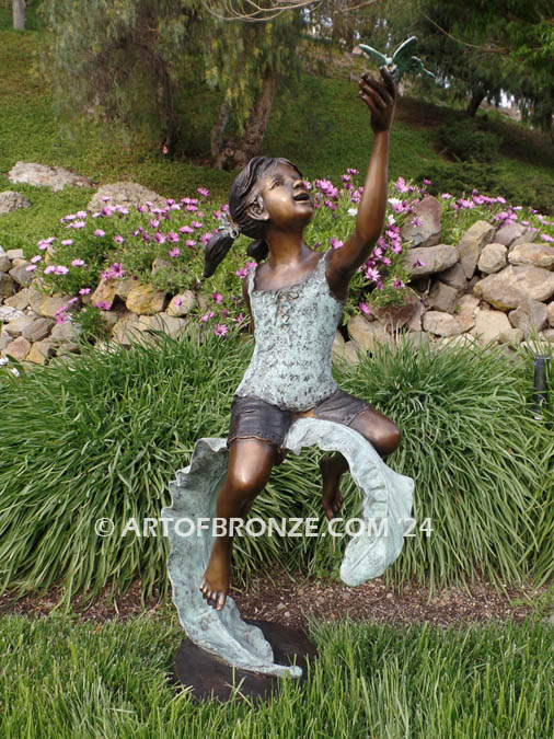 Enchanted Butterfly fantasy bronze sculpture of girl sitting on giant leaf with butterfly