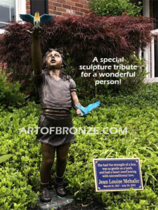 Faith and Hope bronze sculpture of girl letting go of doves