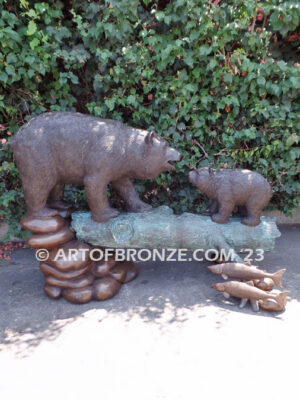 Family Business monumental outdoor bronze sculpture of mother and cub fishing for salmon