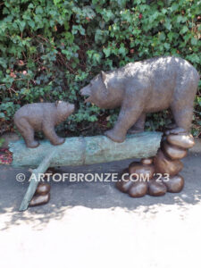 Family Business monumental outdoor bronze sculpture of mother and cub fishing for salmon