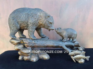 Family Business indoor bronze sculpture of mother and cub walking on log and catching salmon