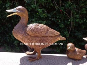 Family Leader outdoor bronze sculptures of walking duck and her ducklings