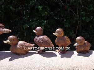 Family Leader outdoor bronze sculptures of walking duck and her ducklings