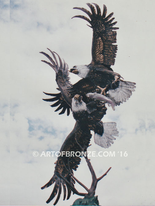 Fish Thieves bronze sculpture of monumental eagles fighting over captured salmon