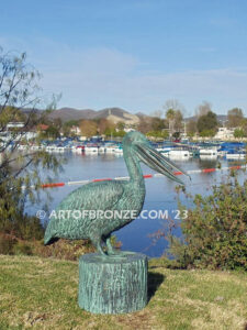 Fisherman bronze sculpture of tranquil pelican on bronze piling