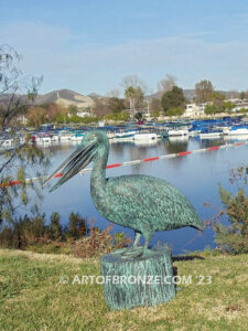 Fisherman bronze sculpture of tranquil pelican on bronze piling