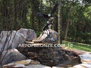 Fish Thieves bronze sculpture of monumental eagles fighting over captured salmon