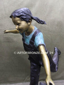 Friends for life outdoor garden bronze sculpture of young girl running with dog