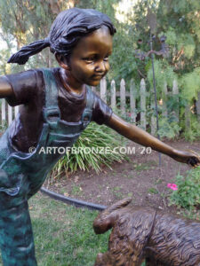 Friends for life outdoor garden bronze sculpture of young girl running with dog