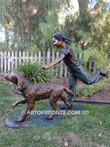 Friends for life outdoor garden bronze sculpture of young girl running with dog