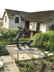 Friends for life outdoor garden bronze sculpture of young girl running with dog