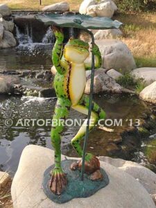 Frog Under Leaf gallery quality standing frog holding up leaf umbrella to shelter from water fountain