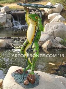 Frog Under Leaf gallery quality standing frog holding up leaf umbrella to shelter from water fountain
