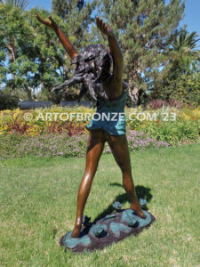 garden breeze woman dancing across water lilies bronze statue