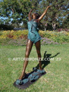 garden breeze woman dancing across water lilies bronze statue