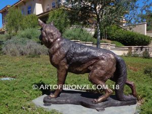 German Shepherd outdoor monumental bronze canine statue standing on alert with mouth open