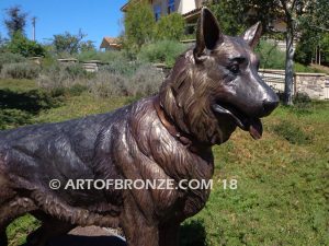 German Shepherd outdoor monumental bronze canine statue standing on alert with mouth open