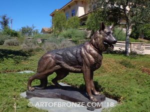 German Shepherd outdoor monumental bronze canine statue standing on alert with mouth open