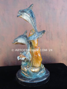 Going Above two dolphins and sea turtle swimming along reef bronze sculpture