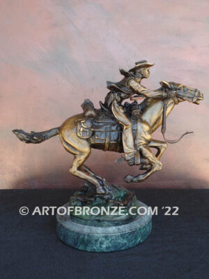 Great Escape bronze sculpture cowboy riding horse with reins in hands