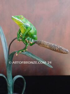 Hangn out tree frog sitting on cattail bronze statue